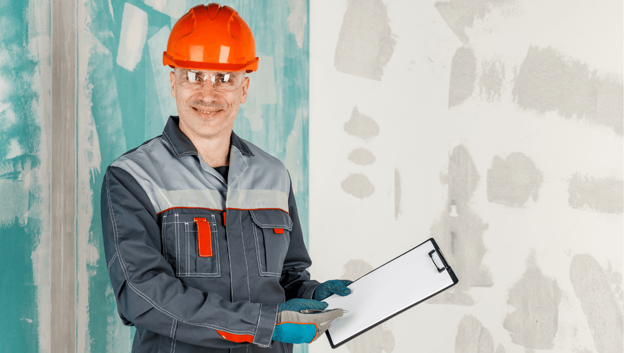 Experienced engineer from a waterproofing company in Dubai inspecting walls for waterproofing and moisture protection.